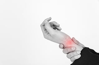 holding injured wrist