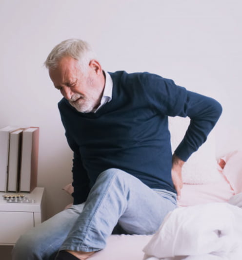 man suffering from ribbing pain waist pain